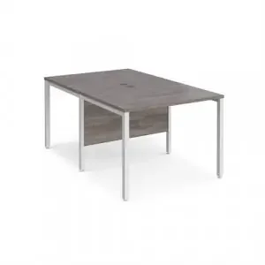 Maestro 25 back to back straight desks 1000mm x 1600mm – white bench leg frame, grey oak top