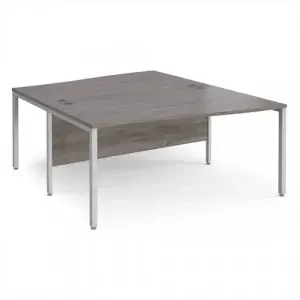 Maestro 25 back to back wave desks 1600mm deep – silver bench leg frame, grey oak top
