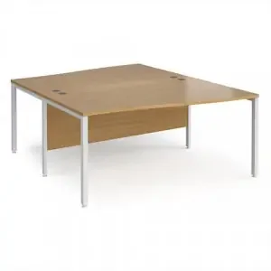 Maestro 25 back to back wave desks 1600mm deep – white bench leg frame, oak top