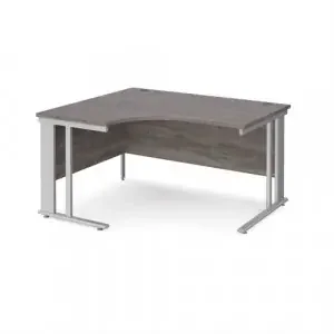 Maestro 25 left hand ergonomic desk 1400mm wide – silver cable managed leg frame, grey oak top