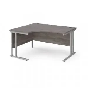Maestro 25 left hand ergonomic desk 1400mm wide – silver cantilever leg frame, grey oak top