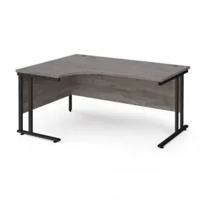 Maestro 25 left hand ergonomic desk 1600mm wide – black cantilever leg frame, grey oak top
