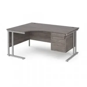 Maestro 25 left hand ergonomic desk 1600mm wide with 2 drawer pedestal – silver cantilever leg frame, grey oak top