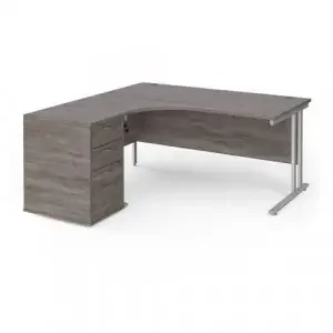 Maestro 25 left hand ergonomic desk 1600mm with silver cantilever frame and desk high pedestal – grey oak